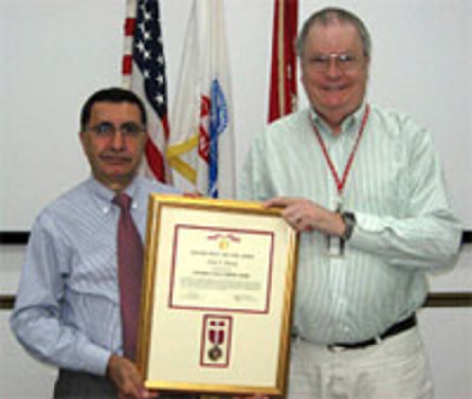 Dr. John Bandy (right) accepts the Army's Superior Civilian Service Award from ERDC-Construction Engineering Research Laboratory Director Dr. Ilker Adiguzel. 