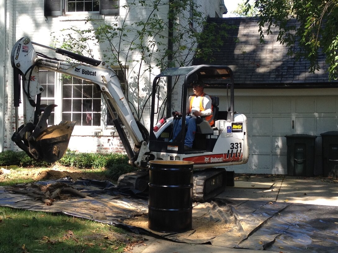 Crews remove arsenic contaminated soil in Spring Valley.  
