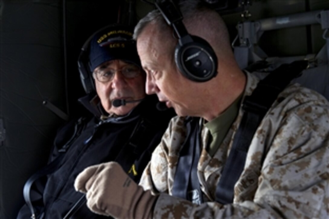 U.S. Defense Secretary Leon E. Panetta flies in a helicopter with U.S. Marine Corps Gen. John R. Allen, commander of International Security Assistance Forces in Afghanistan, over Kabul, Afghanistan, Dec. 12, 2012.