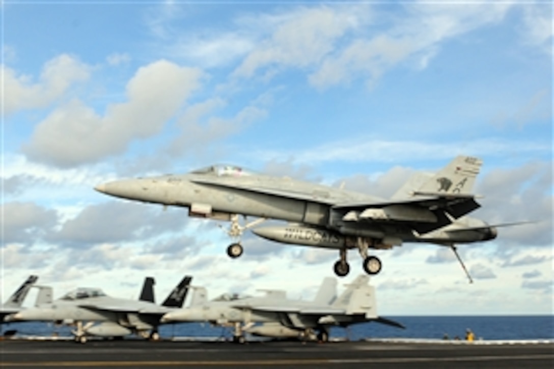 An F/A-18C Hornet lands aboard the aircraft carrier the USS Dwight D. Eisenhower in the Mediterranean Sea, Dec. 7, 2012. The Eisenhower is returning to her homeport of Norfolk after operating in the U.S. 5th and 6th Fleet areas of responsibility.