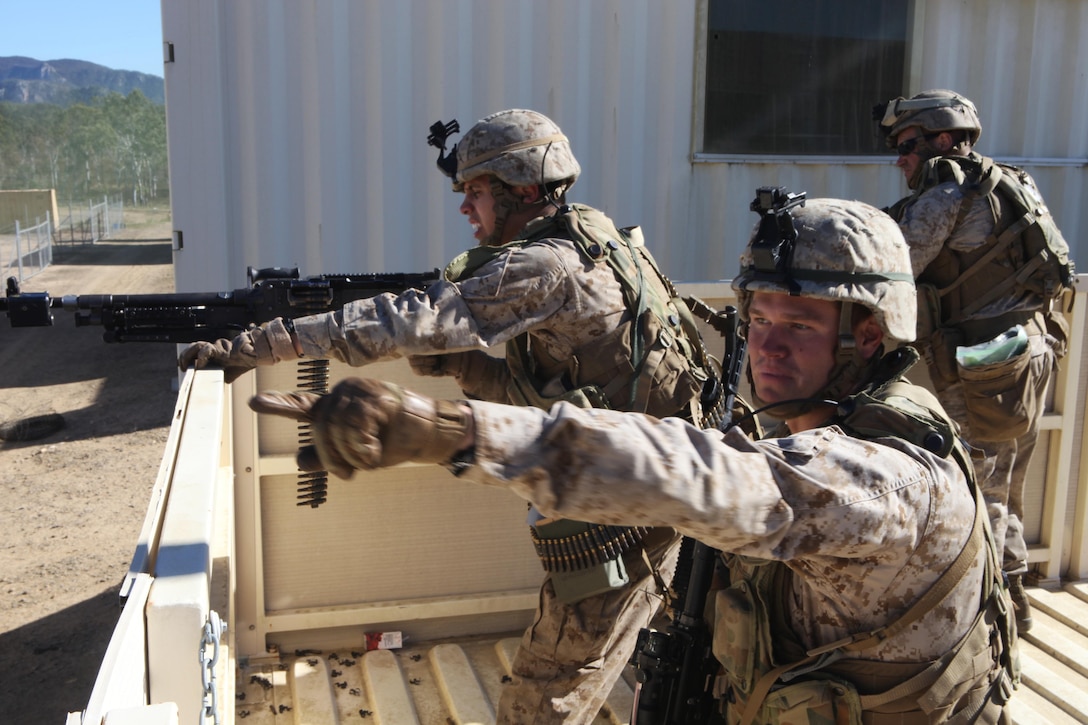 Cpl. Fritz Waechtler, machine gun team leader with Weapons platoon, Company G., Battalion Landing Team 2nd Battalion, 1st Marines, 31st Marine Expeditionary Unit, directs the fire of a M240-G machine gun during the siege of Raspberry Creek here, July 5. The major engagement of the multi-weeklong war during Exercise Hamel 2012, 50 Marines fend off the advancing Australian Army 1st Brigade before eventually being overrun. Exercise Hamel 2012 is a multi-national training evolution between the U.S. Marine Corps, Australian Army and New Zealand Army, aimed at certifying the Australian 1st Brigade for operational deployment. The 31st MEU is the only continuously forward-deployed MEU and is the nation’s force in readiness in the Asia-Pacific region.