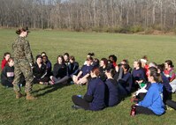 Capt. Casey Chenoweth, officer selction officer, Officer Selection Office West Lafayette, RS Indianapolis, speaks to a group of female poolees before begining a 3-mile hike on Harrison State Park, Indianapolis, Nov. 17.