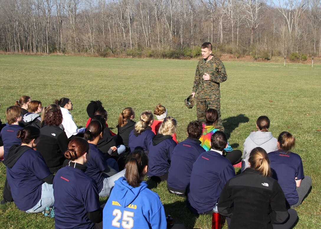 Maj. Geoffry Hollopeter, commanding officer, Recruiting Station Indianapolis, speaks to the female poolees before they begin their three mile hike aboard Harrison State Park, Indianapolis, Ind., Nov. 17.