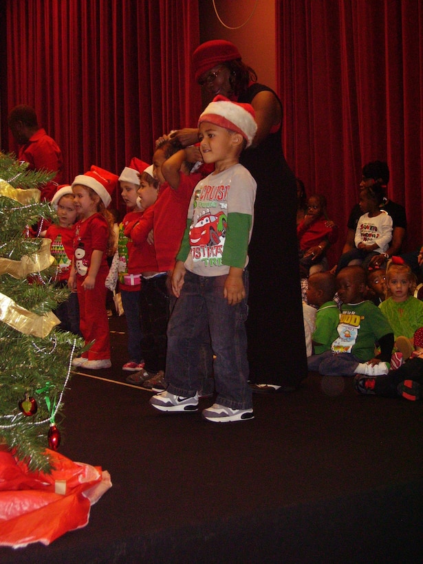 Children, ages toddler to K-4, sing during Marine Corps Logistics Base Albany’s Child Development Center’s Annual Christmas Program at the Base Theater, Dec. 13.