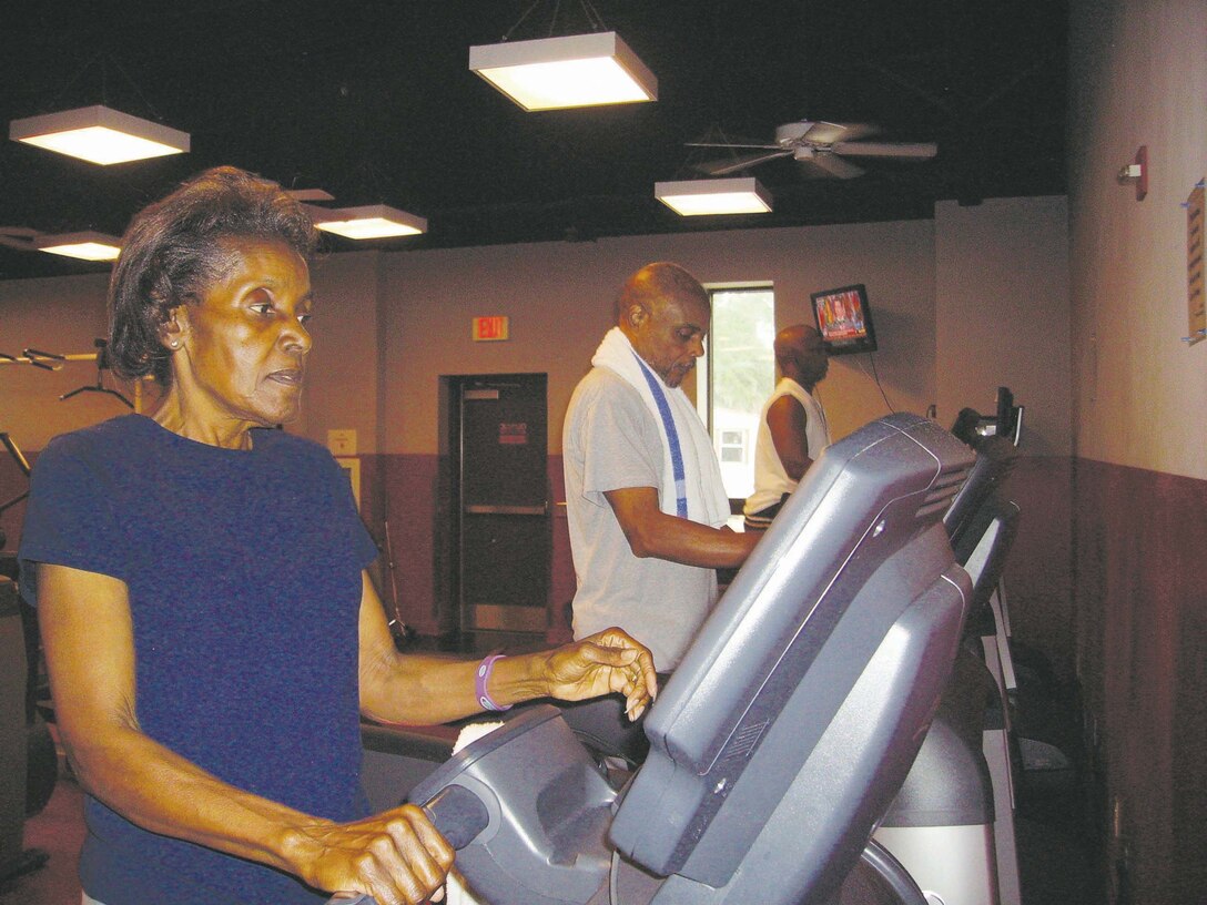 ELois Clark and her husband, Ben, center, work out at Daniels Fitness Center, recently. 