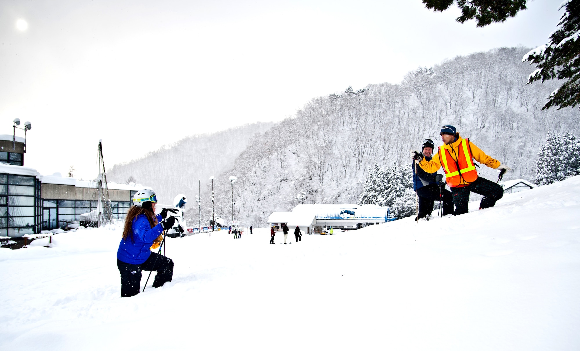 HAKUBA, Japan. -- Junji Kunimatsu, 374th Force Support Squadron Outdoor Recreation tour guide, teaches novice skiers how to climb through snow using their ski poles Dec. 12, 2012, during a beginners ski course. The course was part of a trip to the Japanese Alps hosted by the 374th Force Support Squadron outdoor recreation center. The trips are available for base service members and their families, and outdoor recreation provides 12 free slots per trip offered free of charge to single Airmen. (U.S. Air Force photo/Senior Airman Cody H. Ramirez) (RELEASED)