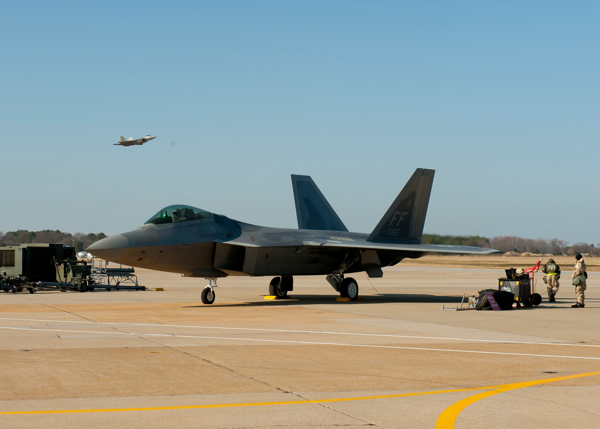 An F-22A sits ready to fly during the final steps of a pre-flight checklist during the phase II combined unit exercise at Langley Air Force Base, Va., Dec. 13, 2012.  The CUE was held to validate the full spectrum of Langley's deployment operations.  (U.S. Air Force photo by Staff Sgt. John D. Strong II/Released)