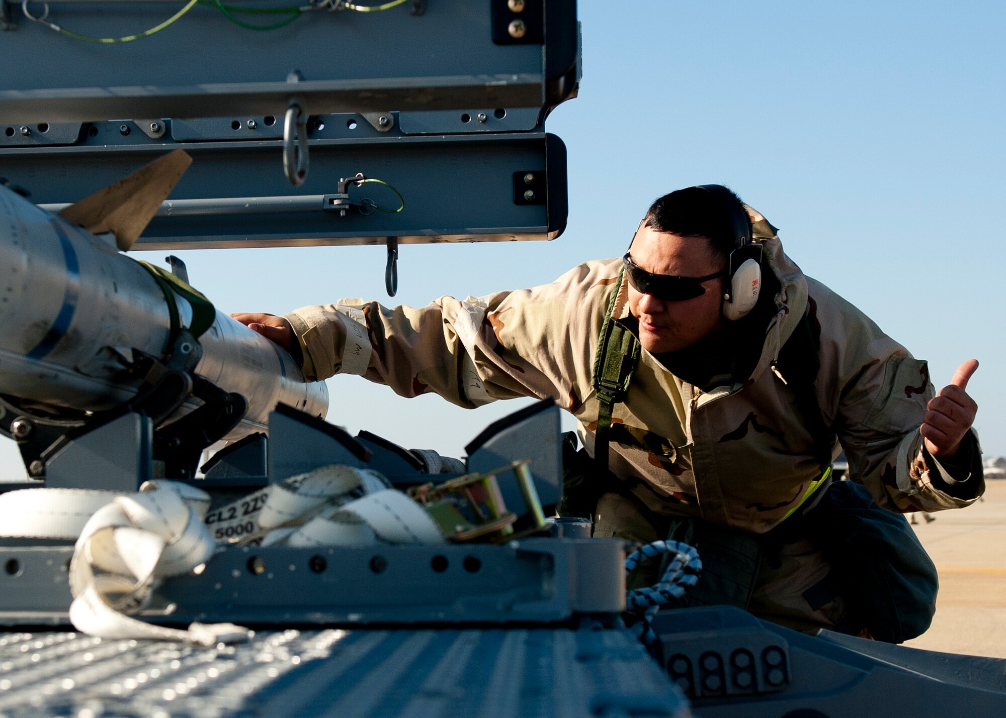 U.S. Air Force Staff Sgt. Joshua Patterson, 27th Aircraft Maintenance Unit, unloads munitions during the phase II combined unit exercise at Langley Air Force Base, Va., Dec. 13, 2012. Wing Exercise Evaluation Team members assessed the ability of the 633rd Air Base Wing, 1st Fighter Wing and 192nd Fighter Wing to deploy. (U.S. Air Force photo by Staff Sgt. John D. Strong II/Released)