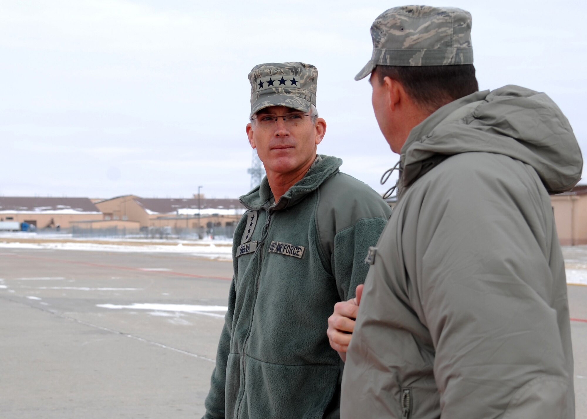 (From left) Gen. Paul Selva, commander, Air Mobility Command, and Col. Tim Bush, 319th Air Base Wing commander, make their way off the flightline on Grand Forks Air Force Base, N.D., on Dec. 13, 2012, during the Selva’s first visit to the base after taking command. (U.S. Air Force photo/Airman 1st Class Xavier Navarro)