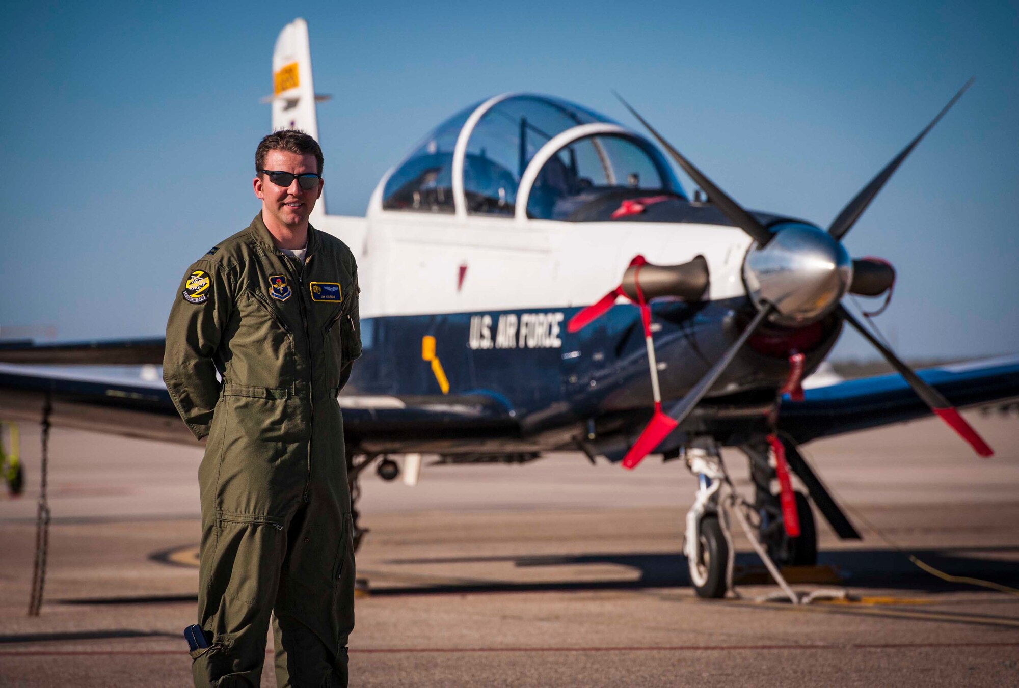 Air Force Capt. James Kareis, 85th Flying Training Squadron instructor pilot, poses for a picture in front of a T-6A Texan II aircraft at Laughlin Air Force Base, Texas, Dec. 12, 2012. During a routine return flight from Fort Worth Alliance Airport, he heard distress calls from an aircraft experiencing engine malfunctions and acted as a liaison between the aircraft and air traffic controllers in Houston, Texas. Kareis helped to ensure responders had accurate coordinates of his location after landing in a field safely. (U.S. Air Force photo/Senior Airman Scott Saldukas)