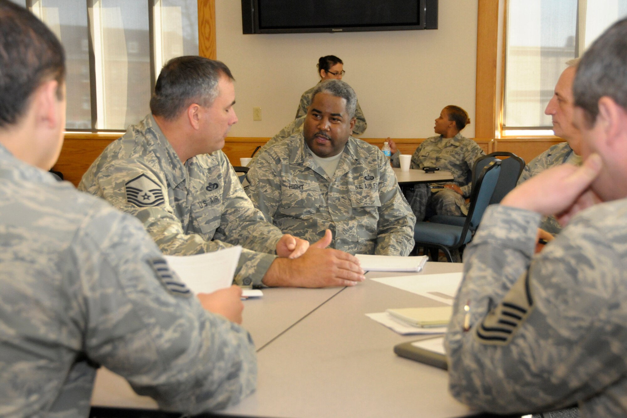 Master Sgt. Al Hight, center, 127th Wing retention manager, talks with Airmen from various states during a training session for Air National Guard Unit Career Advisors at Selfridge Air National Guard Base, Mich., Dec. 12, 2012. Unit Career Advisors help Airmen to utilize their military benefits and helps motivate them to complete a career in the Air National Guard. (Air National Guard photo by Brittani Baisden)