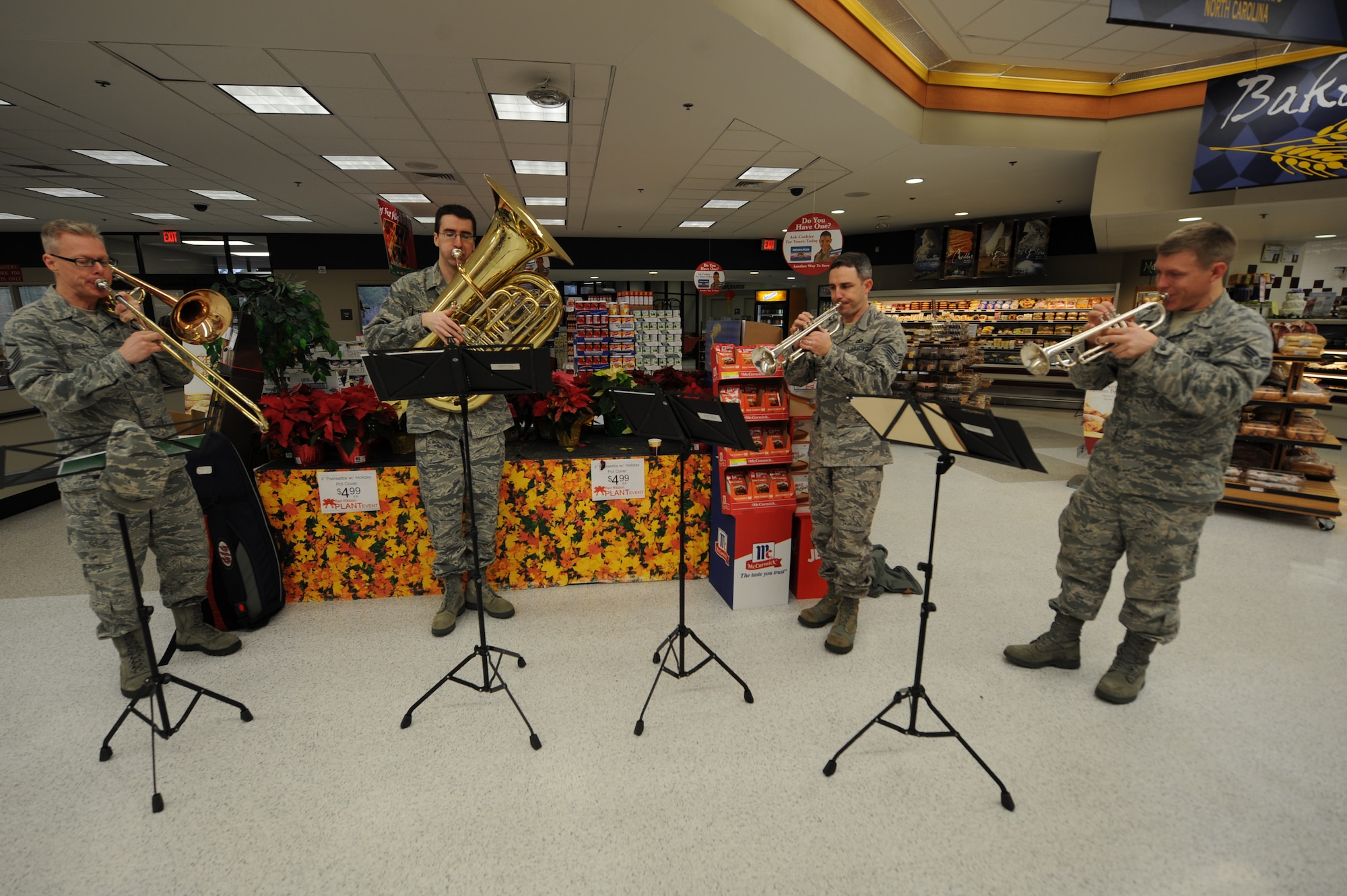 The U.S. Air Force Heritage of America Band brass quartet plays holiday songs at the commissary on Seymour Johnson Air Force Base, N.C., Dec. 12. 2012. The quartet visited several facilities on base including the Exchange, fire department and medical group spreading holiday cheer. (U.S. Air Force photo/Airman 1st Class Aubrey White/Released)