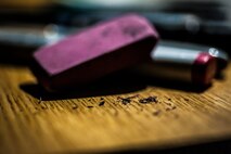 Airman 1st Class John Yurcaba IV, 1st Combat Camera Squadron broadcaster, uses several different types of pens, markers, pencils, charcoal and even erasers when he needs to clean one of his projects up. Yurcaba relaxes during his off-duty time drawing comic book art. (U.S. Air Force photo/ Senior Airman Dennis Sloan)