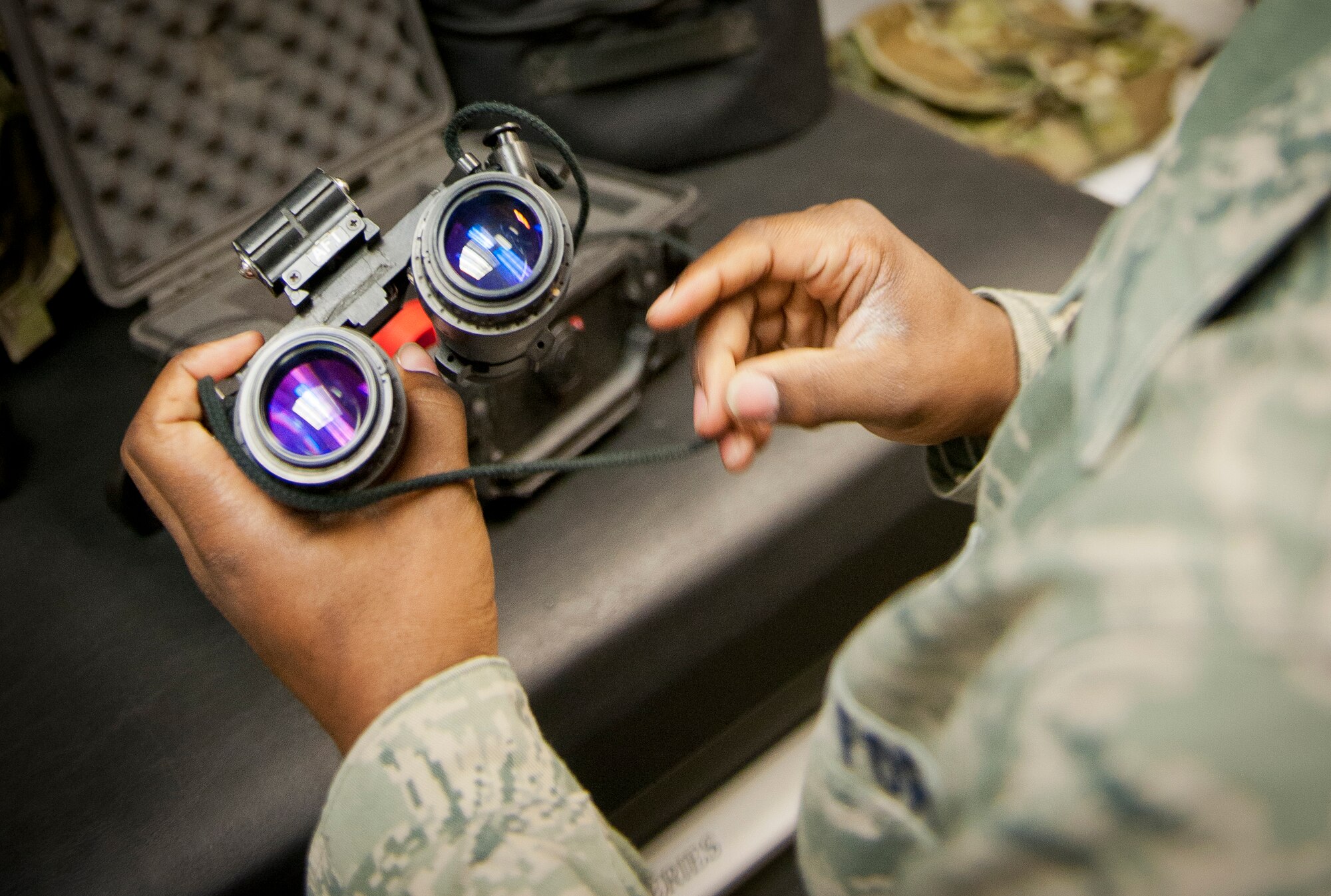 An aircrew flight equipment technician inspects night vision goggles at Moody Air Force Base, Ga., Dec. 6, 2012. Aircrew members are issued a lot of their gear such as fitted helmets, but they have to check out limited items such as night vision goggles. (U.S. Air Force photo by Airman 1st Class Jarrod Grammel/Released)
