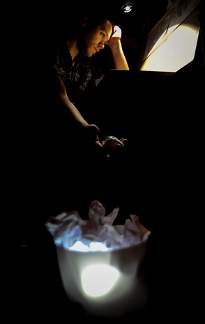 Airman 1st Class John Yurcaba IV, 1st Combat Camera Squadron broadcaster, throws away a drawing that doesn’t live up to his standardss at Joint Base Charleston, S.C. Yurcaba has been drawing since he was old enough to hold a pencil.. (U.S. Air Force photo/ Senior Airman Dennis Sloan)