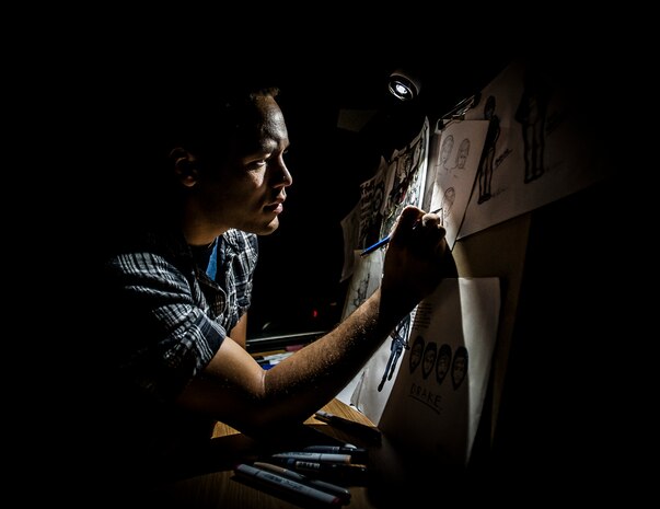Airman 1st Class John Yurcaba IV, 1st Combat Camera Squadron broadcaster, practices drawing portraits of comic book characters he created. Yurcaba has been drawing since he was old enough to hold a pencil. (U.S. Air Force photo/ Senior Airman Dennis Sloan)