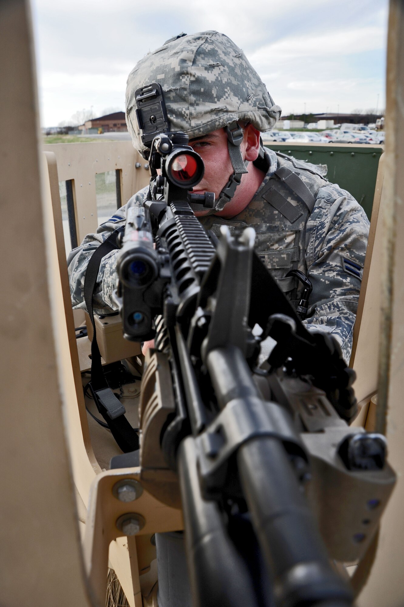 Airman 1st Class Bernard Hyde, 509th Security Forces Squadron patrolman, sights down the scope of his M4 carbine while on patrol Dec. 5 at Whiteman Air Force Base, Mo. As a defender, Hyde is responsible for staying vigilant and ready to respond to any threat 24/7, 365 days a year, holidays included. (U.S. Air Force photo/Senior Airman Nick Wilson) (Released)
