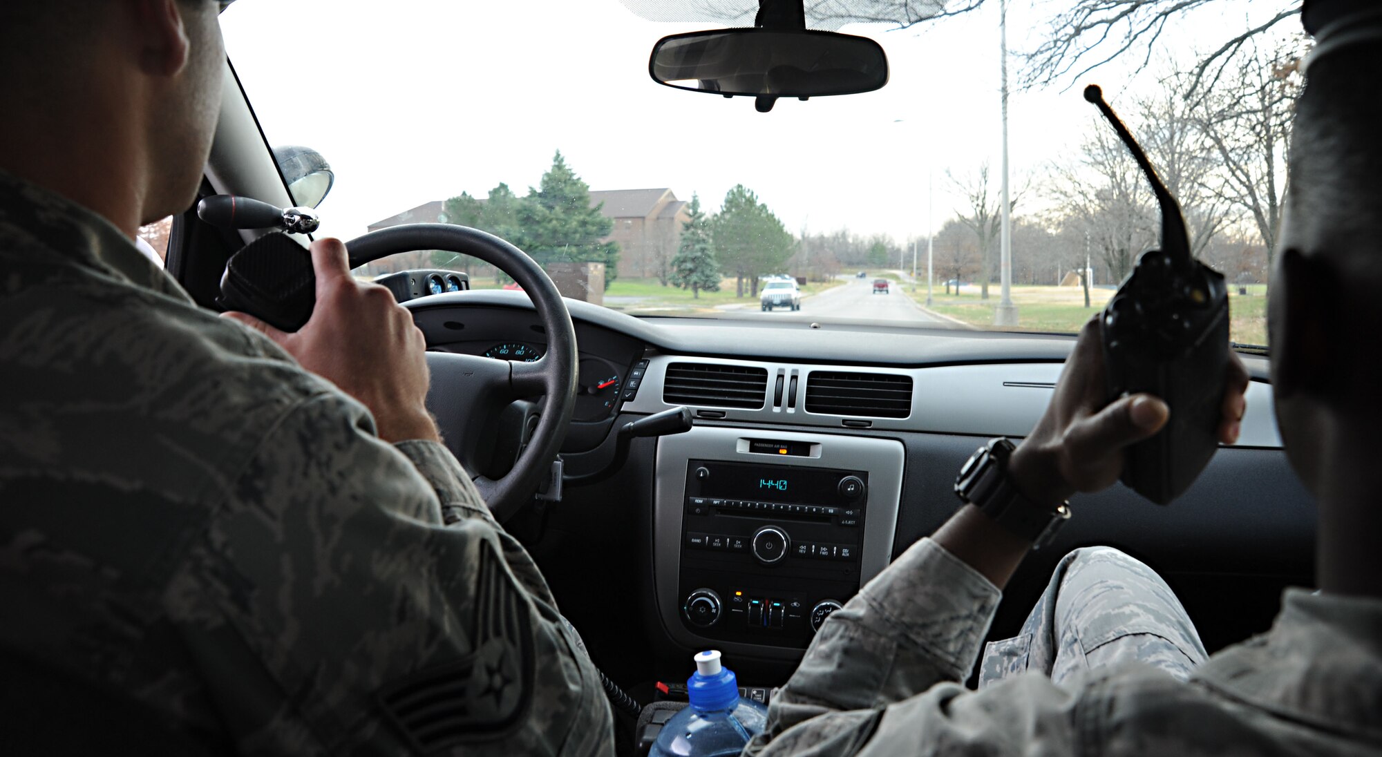 Staff Sgt. Dan Parsons, 509th Security Forces Squadron law enforcement area supervisor, and Airman 1st Class Christopher Anderson, 509th SFS security forces specialist, contact other patrolmen on base during a training exercise Dec. 5 at Whiteman Air Force Base, Mo. Security forces members participate in several different types of training exercises throughout each year to prepare for various threats and base emergencies. (U.S. Air Force photo/Senior Airman Nick Wilson) (Released)