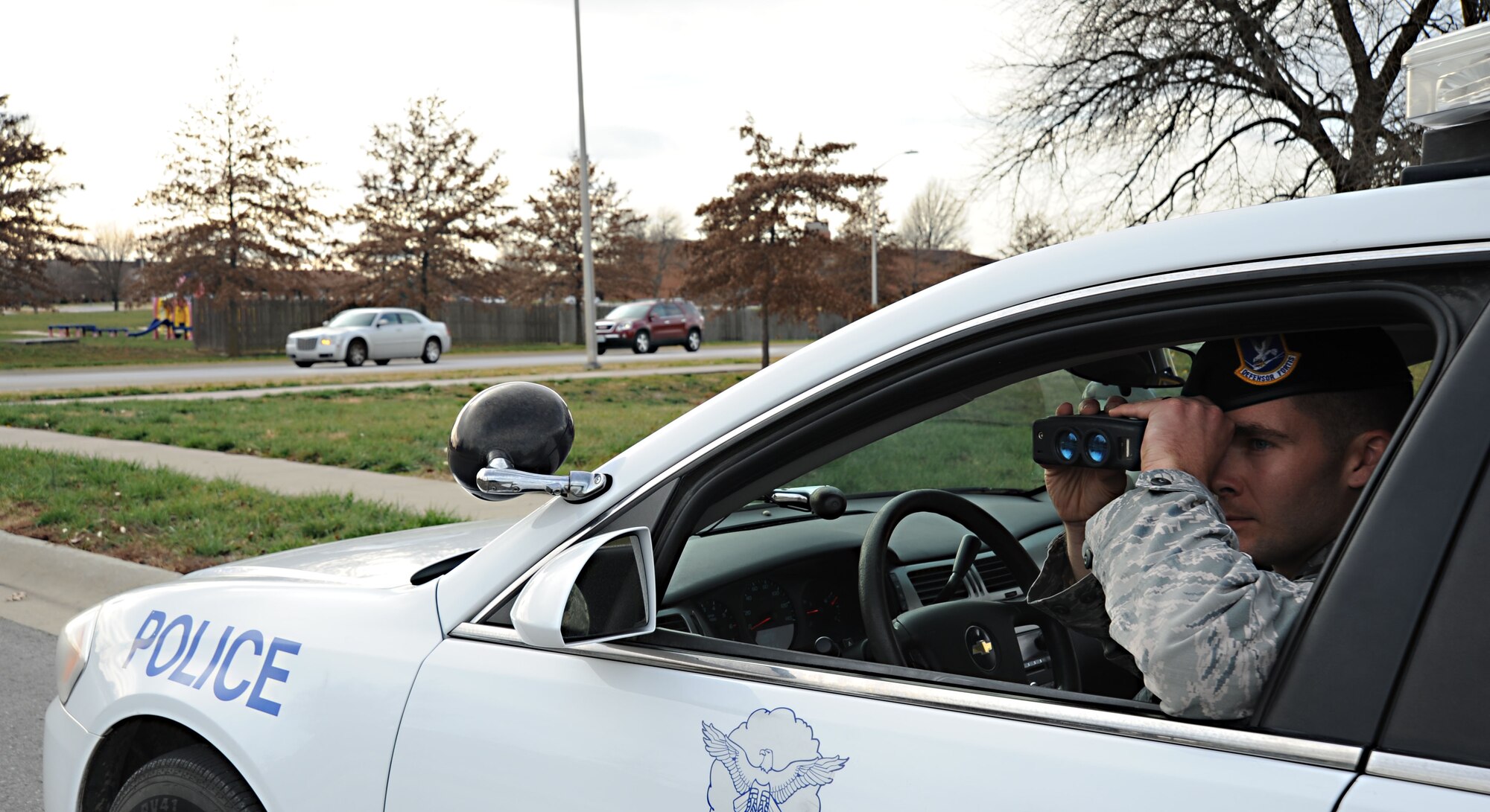 A security forces patrolman uses radar to ensure members of the community are within
the speed limits Dec. 5 at Whiteman Air Force Base, Mo. Individuals who are issued citations may be assessed points, and driving privileges may be suspended due to points incurred over a period of time. (U.S. Air Force photo/Senior Airman Nick Wilson) (Released)
