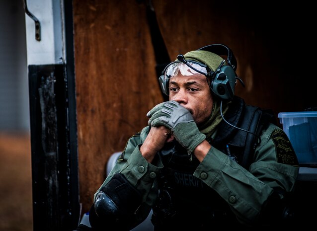 A Charleston County Sheriff’s Office Special Weapons and Tactics member sits on the back of a SWAT van after a hostage extraction training exercise Dec. 6, 2012, at vacant housing on Joint Base Charleston – Air Base, S.C. The SWAT team provides a coordinated response to critical incidents throughout Charleston County, and whenever requested, in other areas throughout the state of South Carolina. (U.S. Air Force photo/ Senior Airman Dennis Sloan)