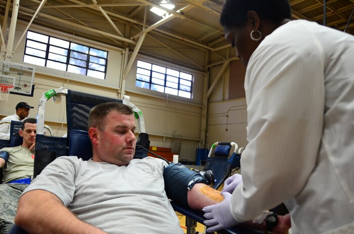 Tech. Sgt. Dustin Smith, 373rd Training Squadron Detachment 5, gives blood during a blood drive Dec. 12, 2012, at Joint Base Charleston – Air Base. Each donor gave a pint of blood, which is then processed and broken down into three components: red cells platelets and plasma. The average time to make a donation is 45 minutes. (U.S. Air Force photo/William O'Brien)