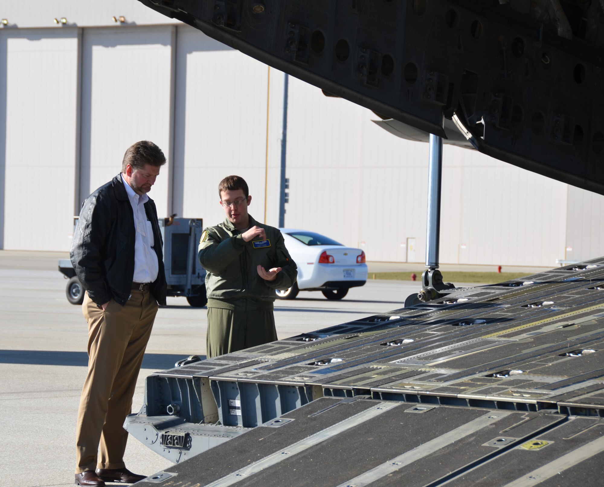 WRIGHT-PATTERSON AIR FORCE BASE, Ohio –Tech. Sgt. Travis Egger, 89th Airlift Squadron loadmaster, explains to Leadership Dayton member Glenn Costie how cargo is loaded onto a C-17 Globemaster III during the group’s visit to Wright-Patterson Air Force Base, Ohio, Dec. 12. (U.S. Air Force photo/Stacy Vaughn) 