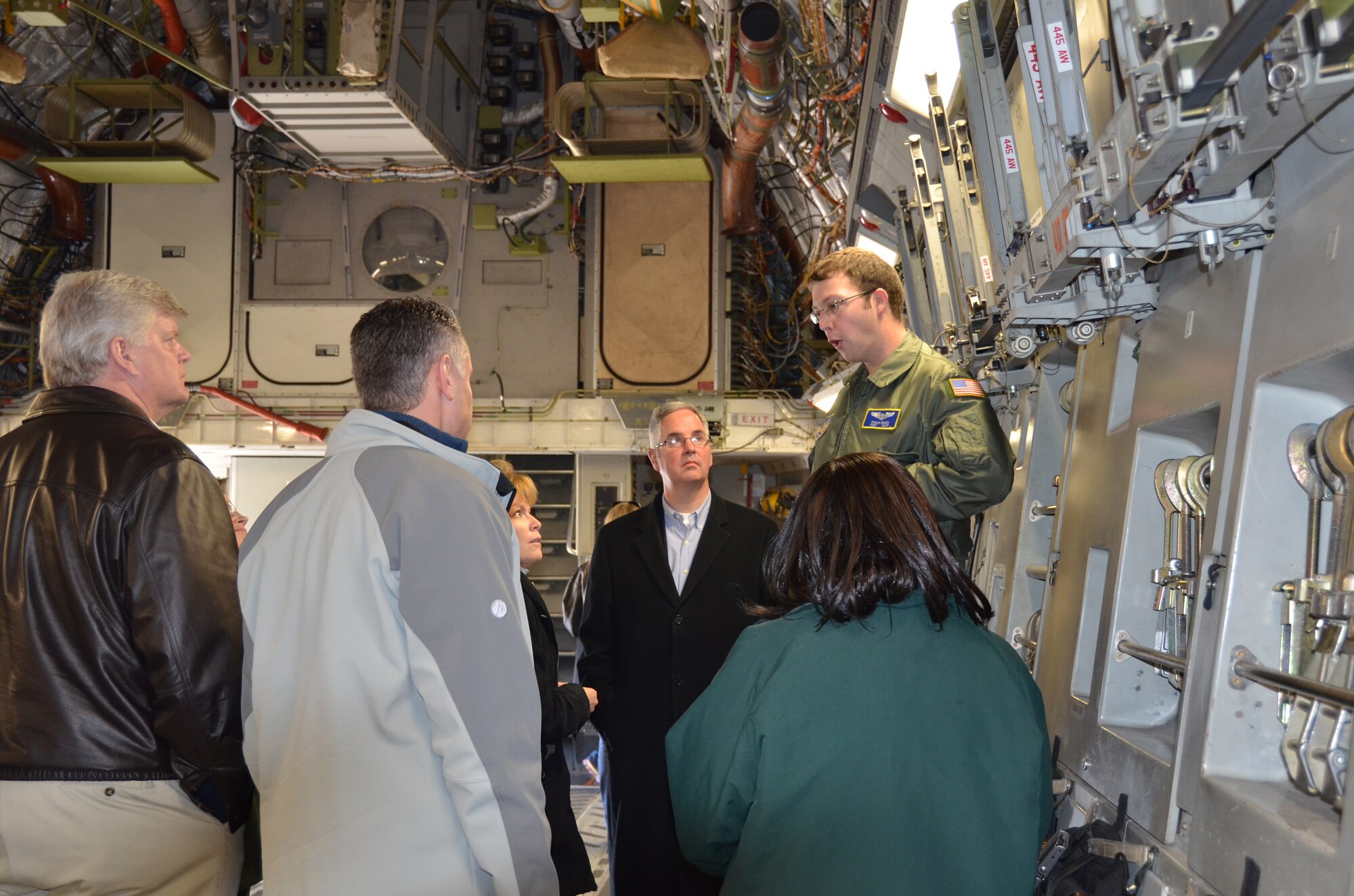 WRIGHT-PATTERSON AIR FORCE BASE, Ohio –Tech. Sgt. Travis Egger, 89th Airlift Squadron loadmaster, shows members of the Leadership Dayton Class of 2013 the cargo area of a C-17 Globemaster III during the group’s visit to Wright-Patterson Air Force Base, Ohio, Dec. 12. (U.S. Air Force photo/Stacy Vaughn) 