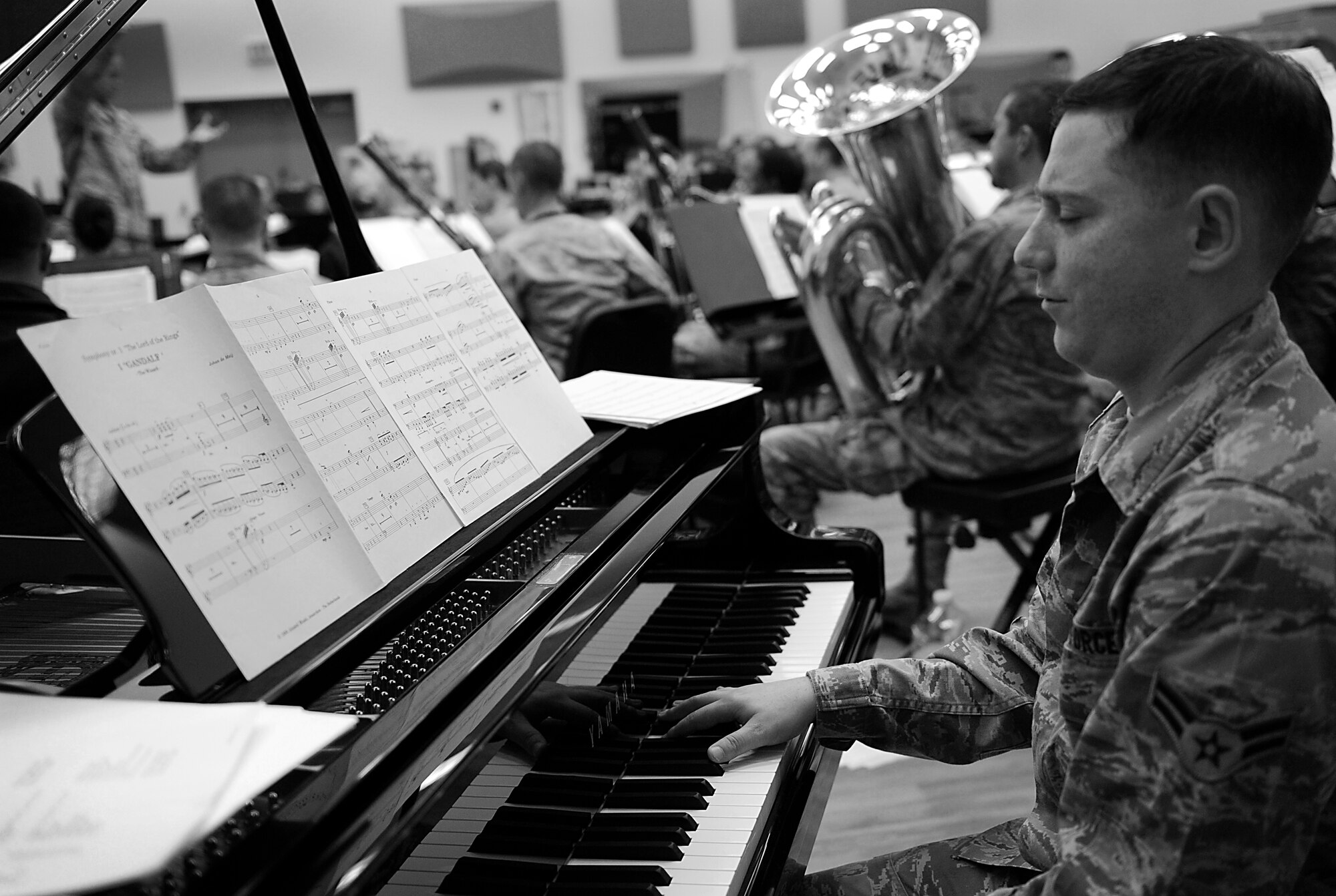 Airman 1st Class Justin Cockerham plays the piano during rehearsal Nov. 7 at Langley Air Force Base, Va. Cockerham brings to the Heritage of America band over 20 years of piano playing experience. (U.S. Air Force photo by Sachel Seabrook/Released)