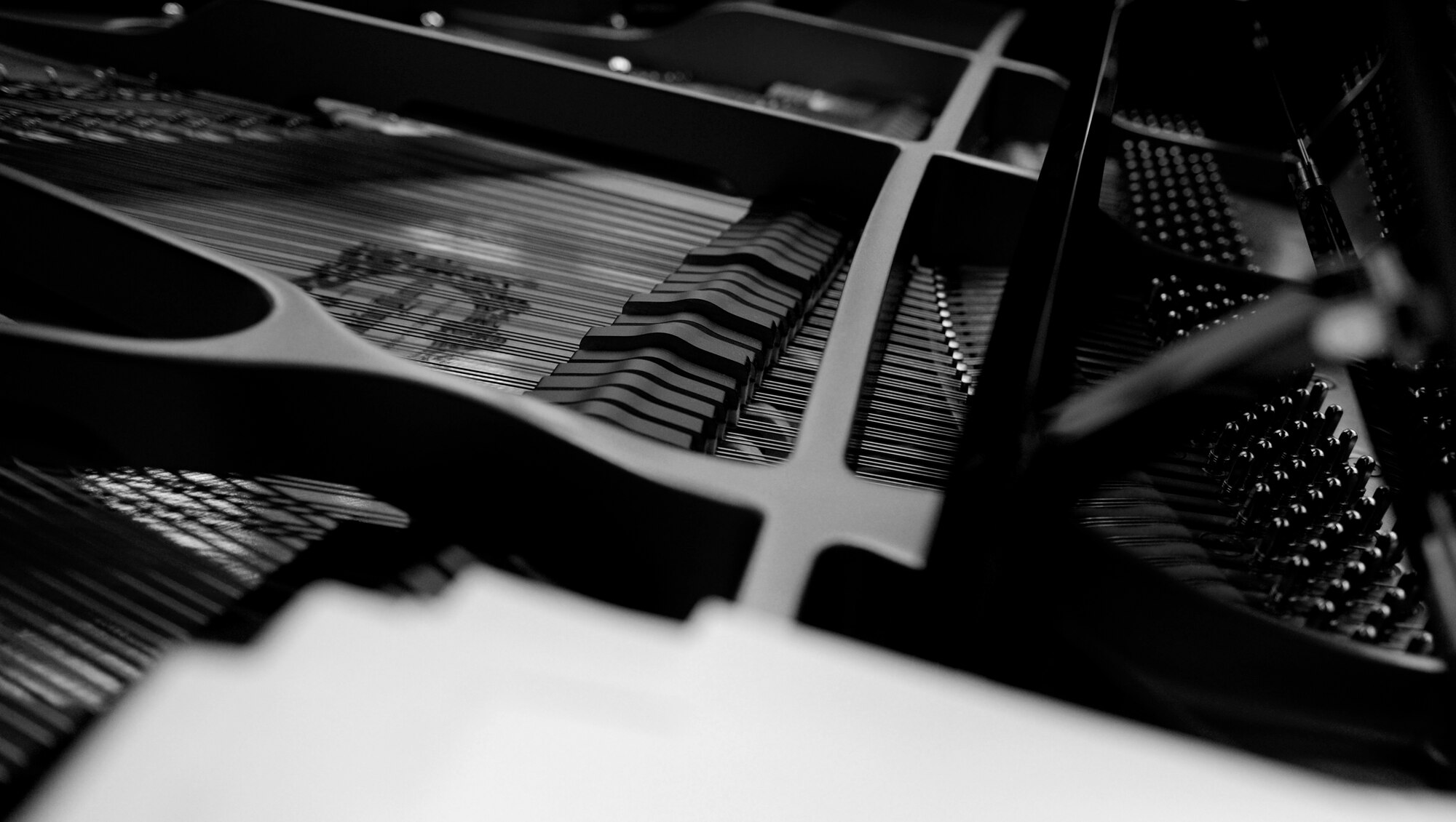 Piano keys raise as Airman 1st Class Justin Cockerham plays during the U.S. Air Force Heritage of America Band rehearsal Nov. 7 at Langley Air Force Base, Va. Airman Cockerham has played the piano since the age of four.  (U.S. Air Force photo by Sachel Seabrook/Released)