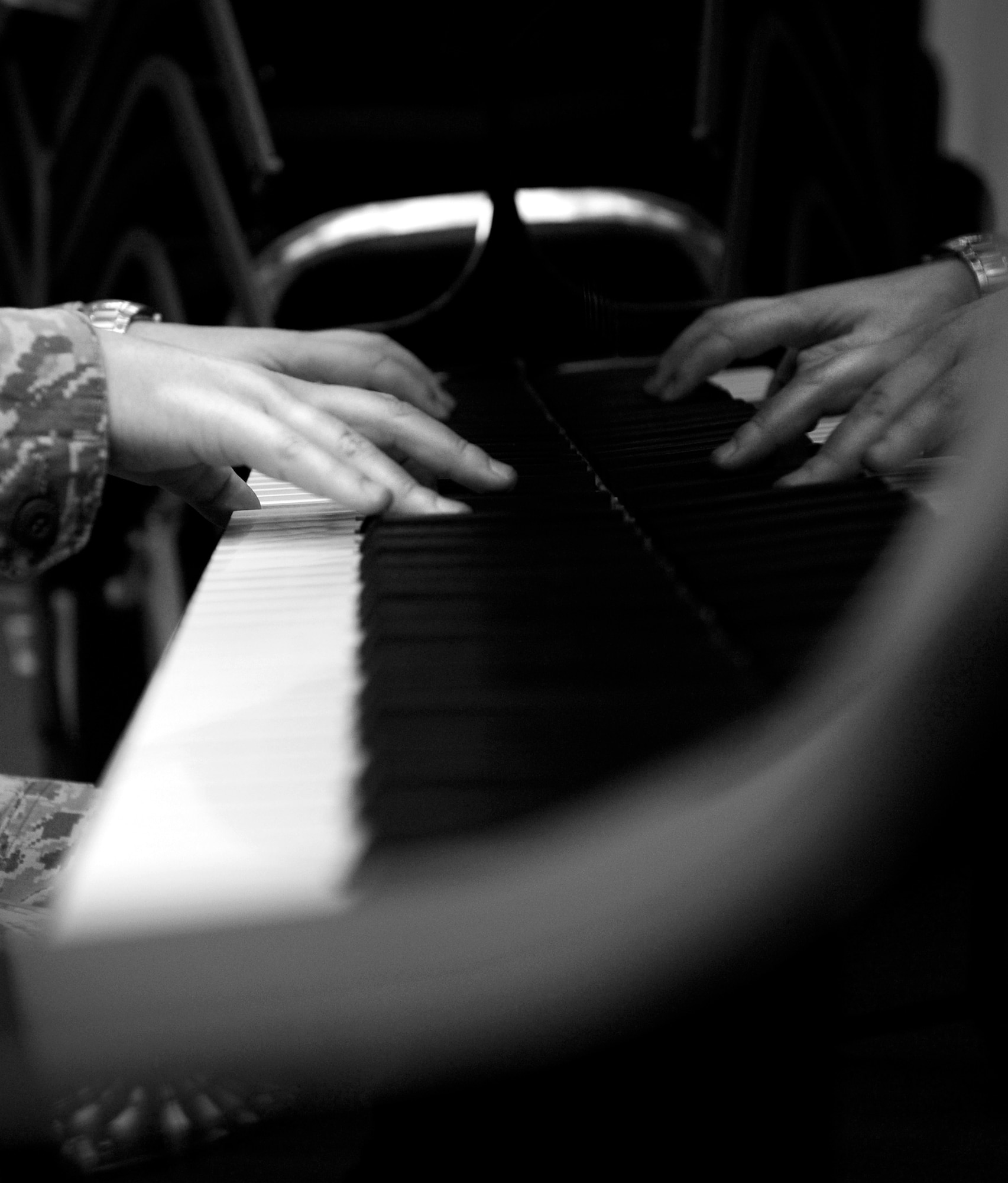 Airman 1st Class Justin Cockerham plays the piano during rehearsal Nov. 7 at Langley Air Force Base, Va. Cockerham brings to the Heritage of America band over 20 years of piano playing experience. (U.S. Air Force photo by Sachel Seabrook/Released)