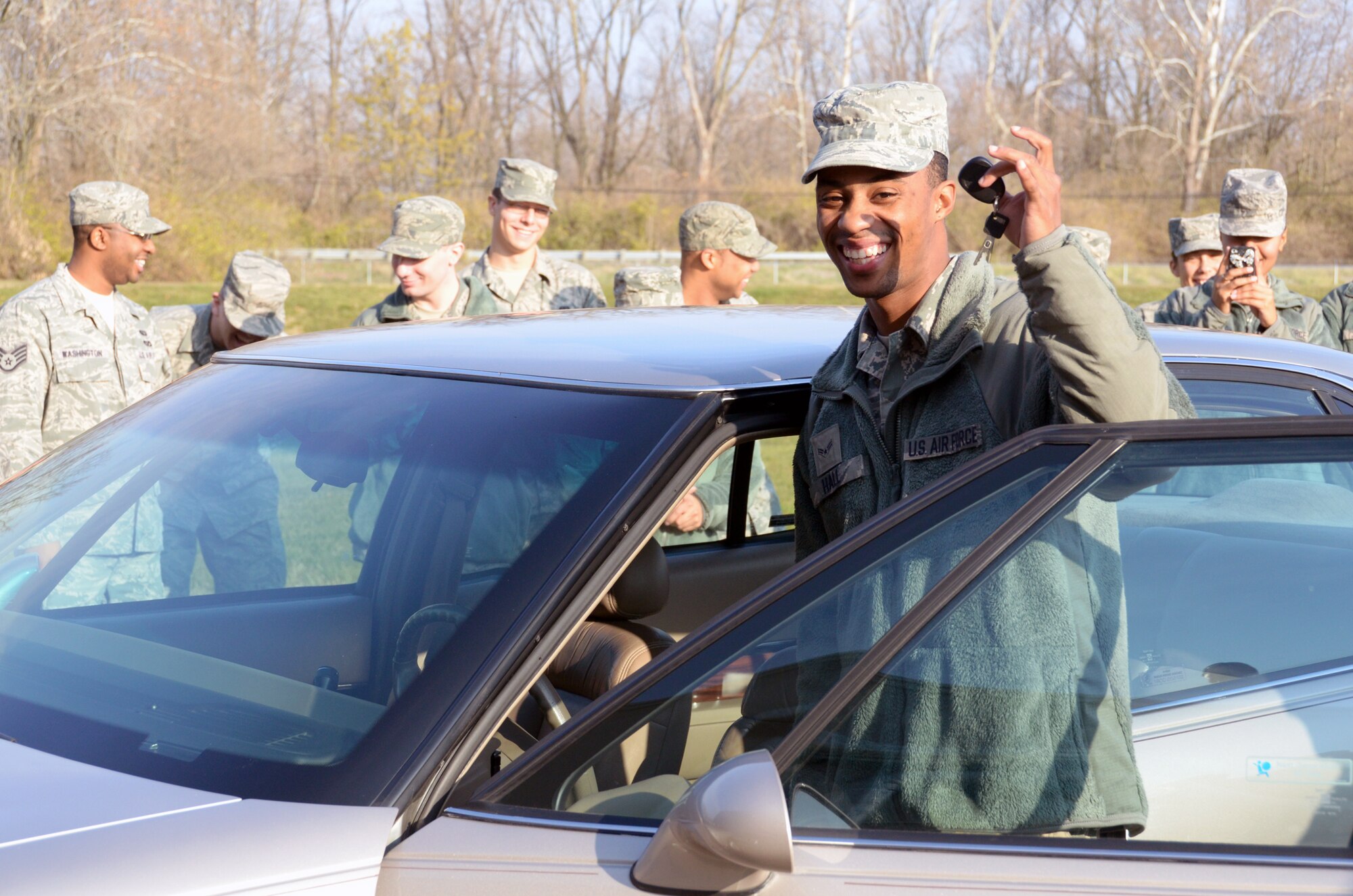 WRIGHT-PATTERSON AIR FORCE BASE, Ohio - Airman 1st Class Stephan Hall, 445th Force Support Squadron services journeyman, receives a car Dec. 1 donated by Dave and Jan Murphy, owners of Murphy’s Autocare of Beavercreek, Ohio, as part of the Charity Cars Program. The Murphy’s along with other organizations are participants in the Charity Cars Program that donates vehicles to those in need. (U.S. Air Force photo/Staff Sgt. Mikhail Berlin)