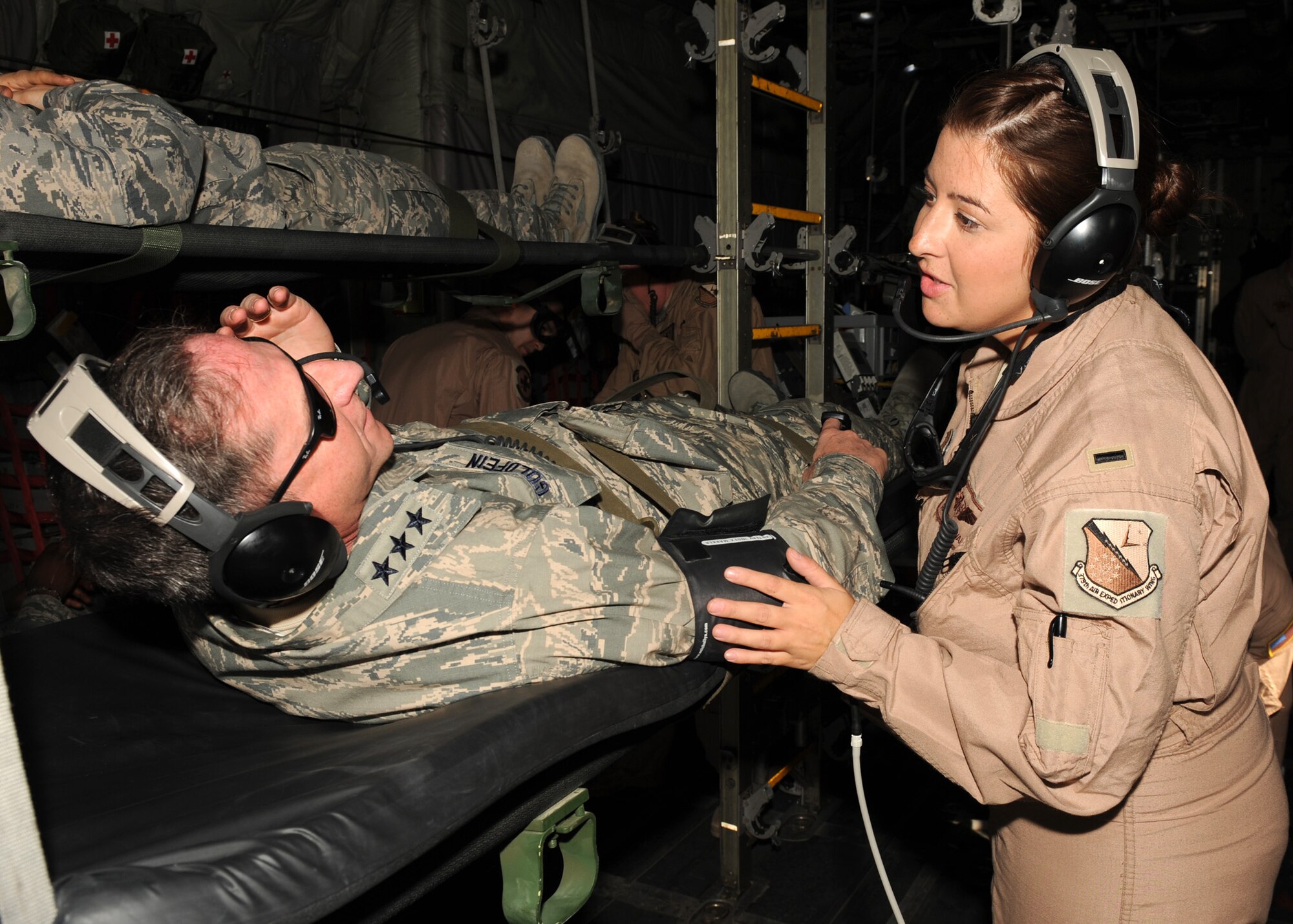 SOUTHWEST ASIA – First Lieutenant Kristina Stewart, 379th Expeditionary Aeromedical Evacuation Squadron flight nurse, takes care of Lt. Gen. David Goldfein, U.S. Air Forces Central Command commander, during a mock C-130 medical evacuation drill Dec. 9. The general volunteered to be a patient to better understand how the squadron works. (U.S. Air Force photo/Senior Airman Joel Mease)