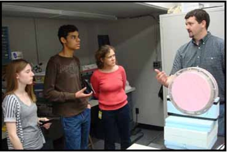 Hanover High School students with their teacher visit ERDC-CRREL as part of their March Intensive activity, LUV: Livelihoods in the Upper Valley, a focus on where residents in the Upper Valley work and what jobs they are doing. In the above photo, CRREL Electronics Engineer Nate Lamie provides a briefing on some of the equipment he uses to support researchers and scientists.