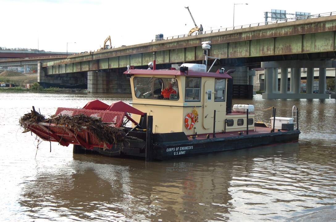 A debris removal boat removes debris from Chesapeake Bay waterways. 