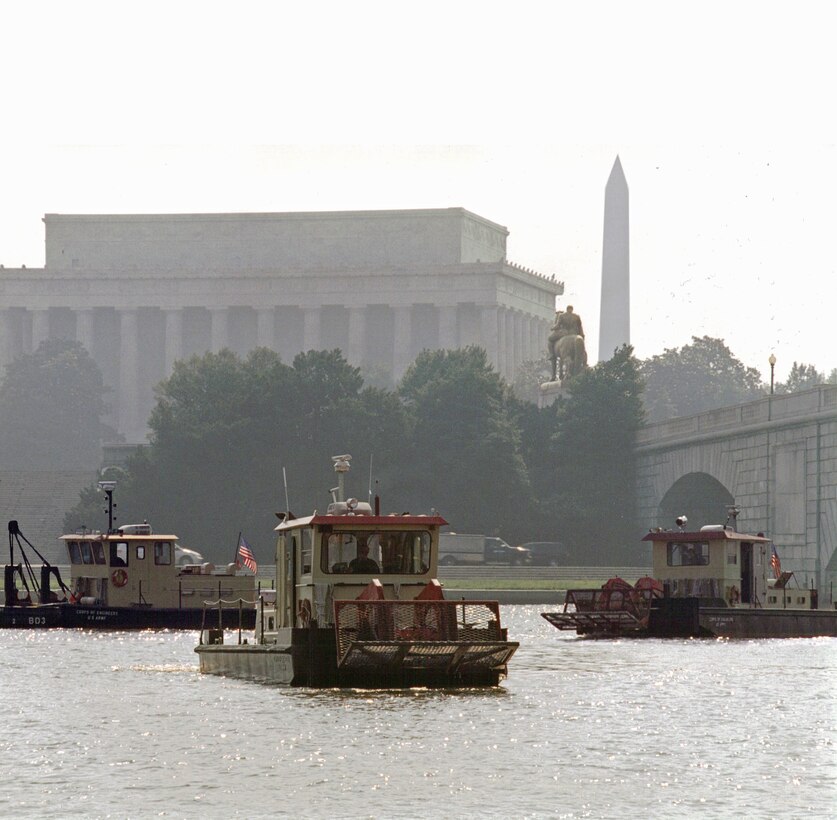 Drift removal vessels gather debris out of a waterway in the District of Columbia.