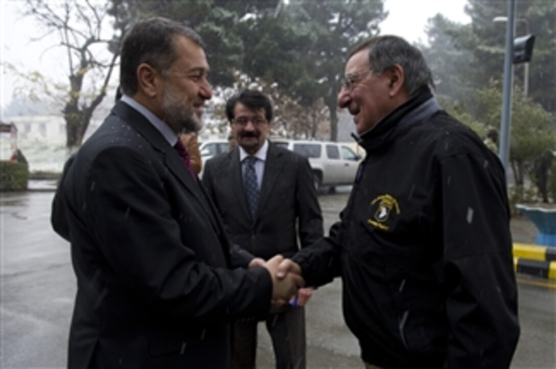 Secretary of Defense Leon E. Panetta, right, shakes hands with Afghan Minister of Defense Bismillah Khan Mohammadi in Kabul, Afghanistan, on Dec. 13, 2012.  Panetta and Bismillah are meeting to discuss regional security items of interest to both nations.   Panetta is on a five-day trip to the region to meet with senior leadership and with the deployed troops.  