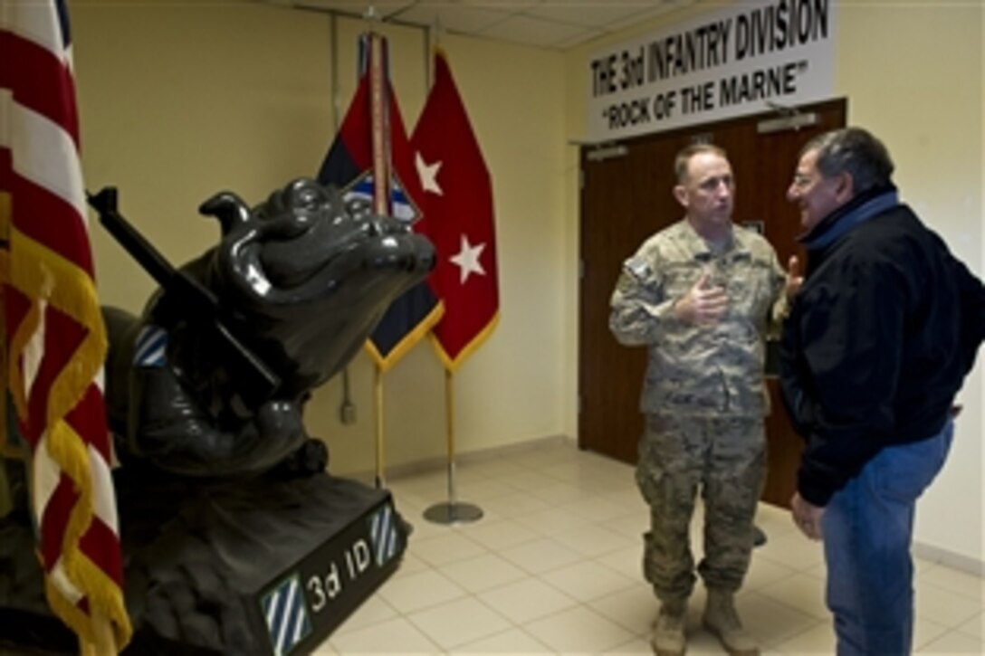 U.S. Defense Secretary Leon E. Panetta looks at the 3rd Infantry Division’s mascot with U.S. Army Maj. Gen. Robert B. Abrams, division commander, at Regional Command South headquarters in Kandahar, Afghanistan, Dec. 13, 2012. 