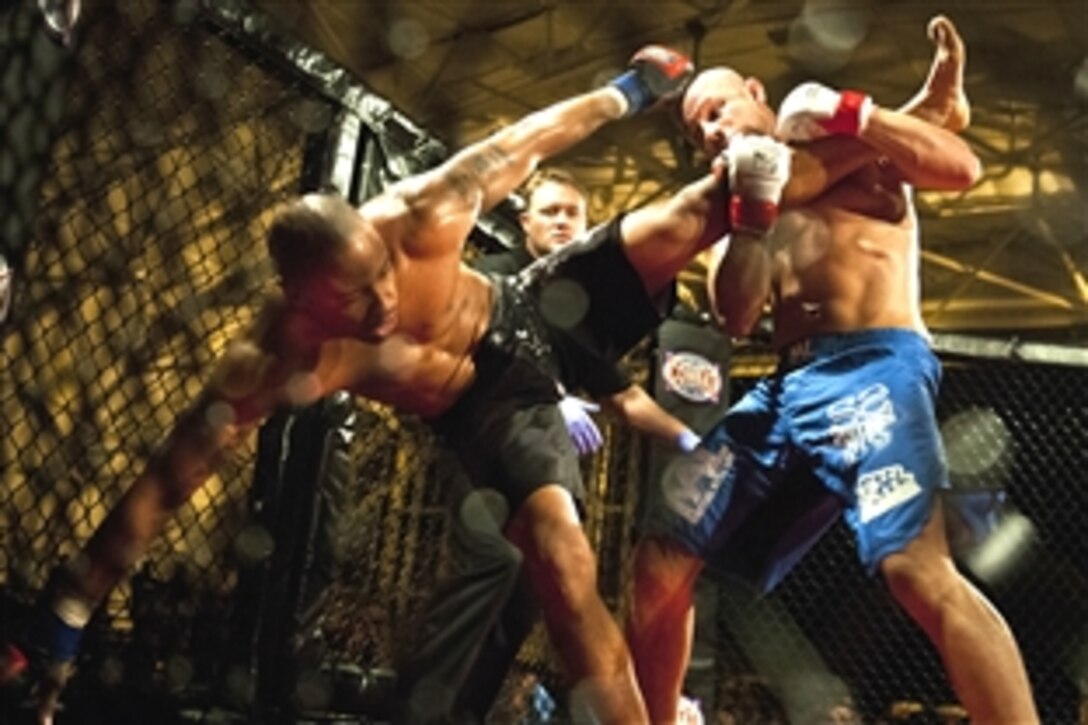 Danny Ruiz, right, takes down William Kuhn during a martial arts event on Eglin Air Force Base, Fla., Dec. 8, 2012. Ruiz, an Air Force Reserve staff sergeant assigned to the 919th Special Operations Wing, won by a unanimous decision in one of 11 matches.