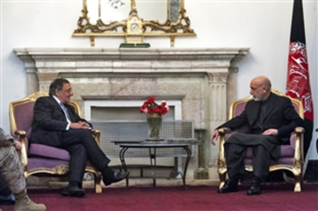 U.S. Defense Secretary Leon E. Panetta, left, meets with Afghanistan President Hamid Karzai for discussions in Kabul, Afghanistan, Dec. 13, 2012. 