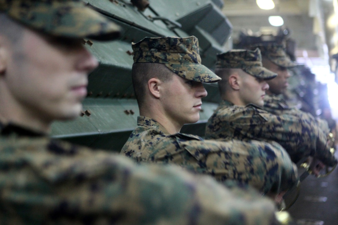 Marines with the 24th Marine Expeditionary Unit practice sword manual during Corporals Course Class 014-13 aboard the USS New York, Dec. 4, 2012. The 24th Marine Expeditionary Unit is deployed with the Iwo Jima Amphibious Ready Group in the 6th Fleet area of responsibility serving as an expeditionary crisis response force capable of a variety of missions from full-scale combat to evacuations and humanitarian assistance.