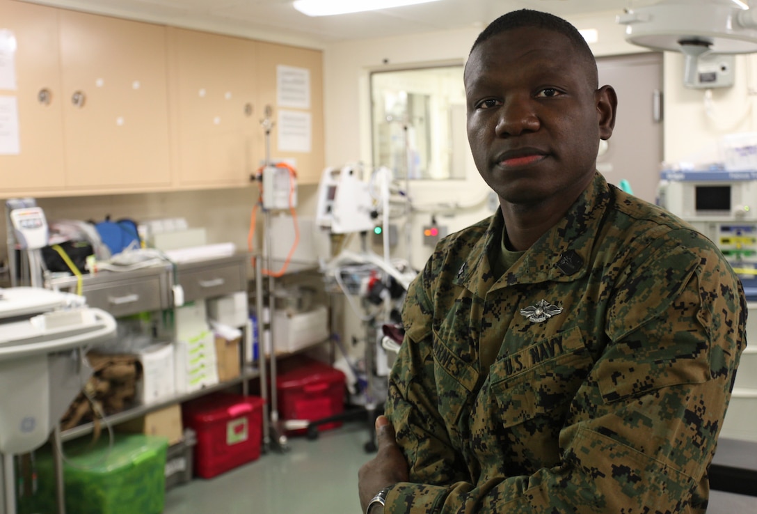 Petty Officer 3rd Class Steve A. Barnes, a hospital corpsman with Alpha Company, Battalion Landing Team 1st Battalion, 2nd Marine Regiment, 24th Marine Expeditionary Unit, poses for a photo in the hospital bay of the USS New York, Dec. 10, 2012. Barnes has spent the last nine months deployed with the 24th MEU, which is currently returning home after completing a successful deployment as an expeditionary crisis response force in the Navy's 5th and 6th Fleet areas of responsibility.
