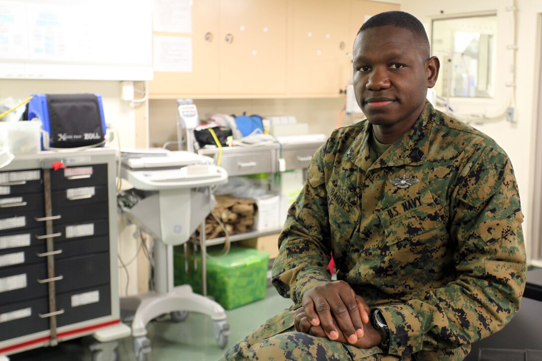 Petty Officer 3rd Class Steve A. Barnes, a hospital corpsman with Alpha Company, Battalion Landing Team 1st Battalion, 2nd Marine Regiment, 24th Marine Expeditionary Unit, poses for a photo in the hospital bay of the USS New York, Dec. 10, 2012. Barnes has spent the last nine months deployed with the 24th MEU, which is currently returning home after completing a successful deployment as an expeditionary crisis response force in the Navy's 5th and 6th Fleet areas of responsibility.