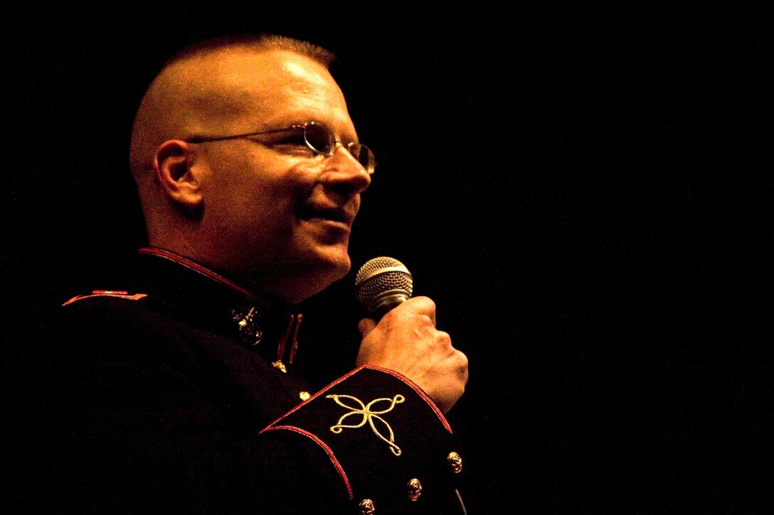 Chief Warrant Officer 3 Benjamin Bartholomew addresses the crowd at the 2nd MAW Band Christmas concert Dec. 7 at Marine Corps Air Station Cherry Point, N.C. Bartholomew is the band’s director. He said he enjoyed the opportunity to play for the local community. “We always strive to be the best U.S. Marine Corps the people want us to be,” Bartholomew said. “Whatever expectations they have about Marines, we want to meet or exceed those expectations.”


