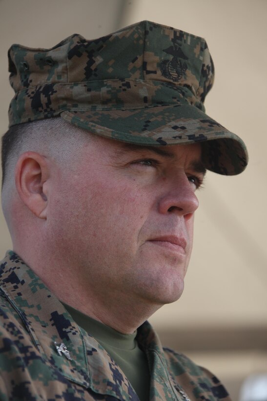 Col. Jeff S. Kojac, the incoming commanding officer of Marine Air Control Group 28, watches the 2nd Marine Aircraft Wing Band perform at the MACG-28 change of command at the Marine Air Control Squadron 2’s parade field Dec. 5. Kojac's achievements include being the speechwriter for the 32nd Commandant of the Marine Corps and serving as a director of defense policy for the National Security Council.