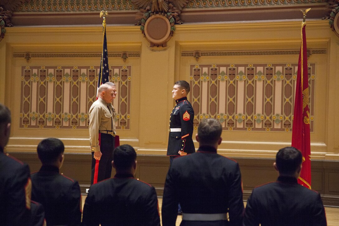 Cpl. David M. Gerardi recieves the Silver Star from Maj. Gen. Melvin Spiese, commanding general of 1st Marine Expeditionary Brigade Dec. 10, for his actions while deployed to Afghanistan.