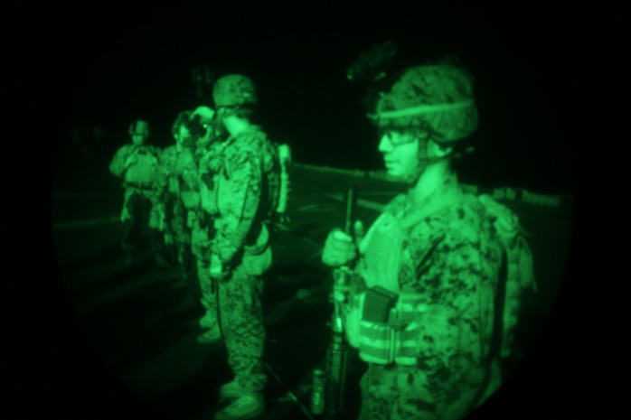 Marines with Security Platoon, Headquarters and Service Company, Battalion Landing Team 1st Battalion, 2nd Marine Regiment, 24th Marine Expeditionary Unit, prepare to conduct a night live-fire training exercise aboard USS Iwo Jima, Dec. 9, 2012. The 24th MEU is deployed with the Iwo Jima Amphibious Ready Group and is currently in the 6th Fleet area of responsibility. Since deploying in March, they have supported a variety of missions in the U.S. Central, Africa and European Commands, assisted the Navy in safeguarding sea lanes, and conducted various bilateral and unilateral training events in several countries in the Middle East and Africa. (U.S. Marine Corps photo by Lance Cpl. Tucker S. Wolf/Released)