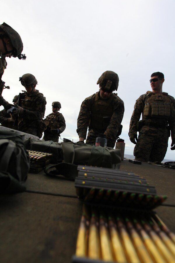 Marines with Security Platoon, Headquarters and Service Company, Battalion Landing Team 1st Battalion, 2nd Marine Regiment, 24th Marine Expeditionary Unit, prepare to conduct a live-fire training exercise aboard USS Iwo Jima, Dec. 9, 2012. The 24th MEU is deployed with the Iwo Jima Amphibious Ready Group and is currently in the 6th Fleet area of responsibility. Since deploying in March, they have supported a variety of missions in the U.S. Central, Africa and European Commands, assisted the Navy in safeguarding sea lanes, and conducted various bilateral and unilateral training events in several countries in the Middle East and Africa. (U.S. Marine Corps photo by Lance Cpl. Tucker S. Wolf/Released)