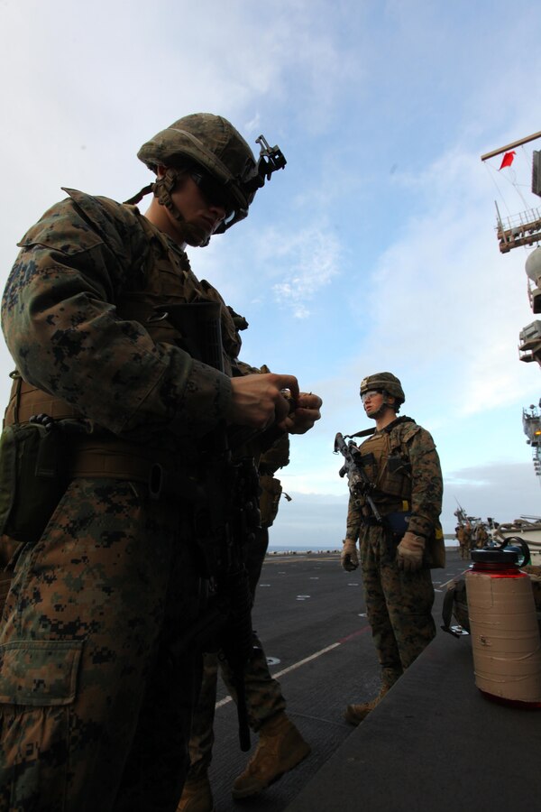 Lance Cpl. Timothy Wade, a Boston, Mass., native with Security Element, Headquarters and Service Company, Battalion Landing Team 1st Battalion, 2nd Marine Regiment, 24th Marine Expeditionary Unit, loads his magazine in preparation to conduct a live-fire training exercise aboard USS Iwo Jima, Dec. 9, 2012. The 24th MEU is deployed with the Iwo Jima Amphibious Ready Group and is currently in the 6th Fleet area of responsibility. Since deploying in March, they have supported a variety of missions in the U.S. Central, Africa and European Commands, assisted the Navy in safeguarding sea lanes, and conducted various bilateral and unilateral training events in several countries in the Middle East and Africa. (U.S. Marine Corps photo by Lance Cpl. Tucker S. Wolf/Released)