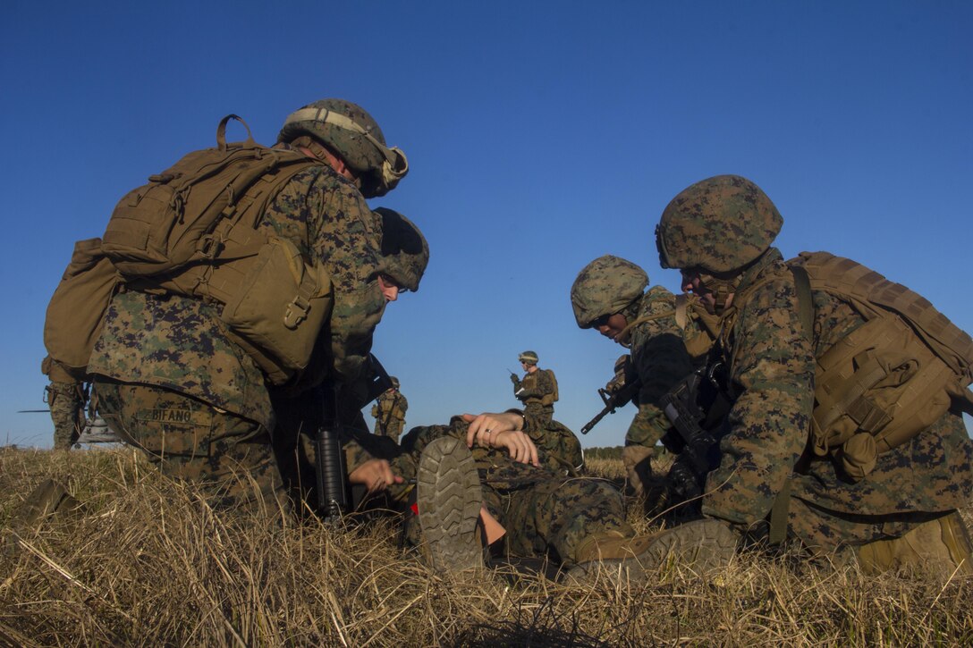 Marines and sailors of Combat Logistics Battalion (CLB) 26, 26th Marine Expeditionary Unit (MEU), carry a casualty during a mass casualty scenario during the MEU's Group Sail exercise, Camp Lejeune, N.C., Dec. 14, 2012. Group Sail consists of multiple training scenarios to include different variations of raids; visit, board, search and seizure (VBSS) training; and tactical recovery of aircraft and personnel (TRAP) simulations. The 26th MEU operates continuously across the globe, providing the president and unified combatant commanders with a forward-deployed, sea-based quick reaction force. The MEU is a Marine Air-Ground Task Force capable of conducting amphibious operations, crisis response, and limited contingency operations. The 26th MEU is slated to deploy in 2013. (Official U.S. Marine Corps photograph by Cpl. Michael Lockett)