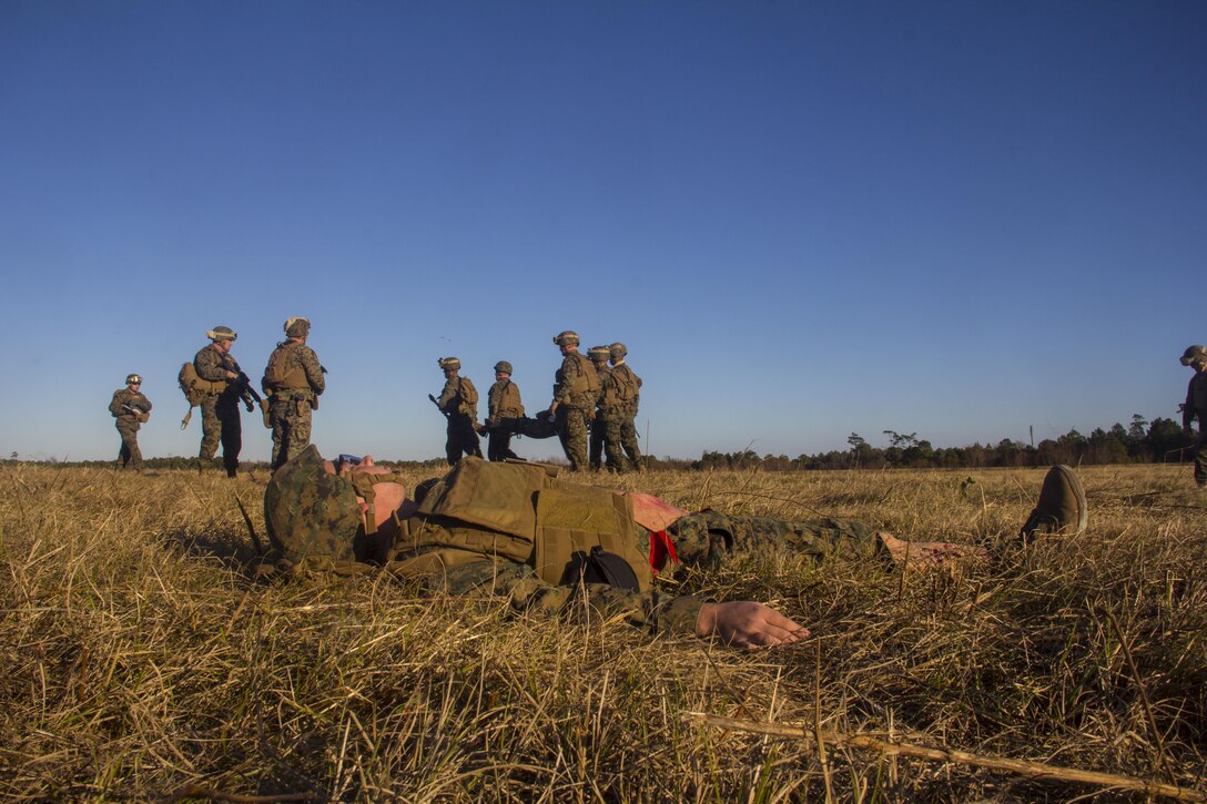 Marines and sailors of Combat Logistics Battalion (CLB) 26, 26th Marine Expeditionary Unit (MEU), participate in a mass casualty scenario during the MEU's Group Sail exercise, Camp Lejeune, N.C., Dec. 14, 2012. Group Sail consists of multiple training scenarios to include different variations of raids; visit, board, search and seizure (VBSS) training; and tactical recovery of aircraft and personnel (TRAP) simulations. The 26th MEU operates continuously across the globe, providing the president and unified combatant commanders with a forward-deployed, sea-based quick reaction force. The MEU is a Marine Air-Ground Task Force capable of conducting amphibious operations, crisis response, and limited contingency operations. The 26th MEU is slated to deploy in 2013. (Official U.S. Marine Corps photograph by Cpl. Michael Lockett)